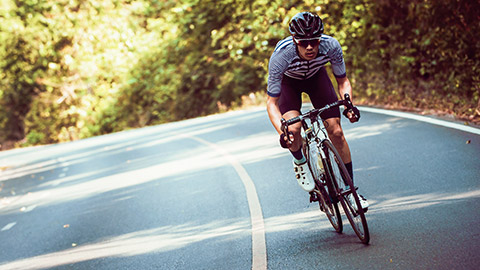 cyclist riding in forest