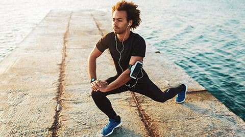 Runner doing lunge exercise