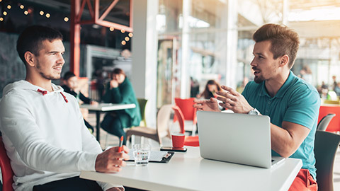 Trainer talking with client