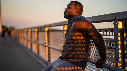 Larger man exercising outside