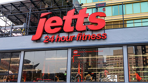 Outside signage of Jetts fitness on building