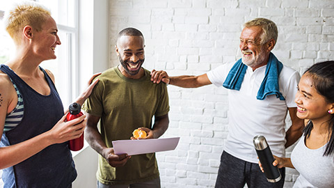 Diverse group of clients with smiling trainer