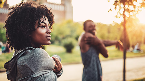 Young african american couple exercising outdoors at sunrise