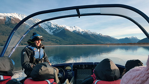 tour guide on a boat talking to clients