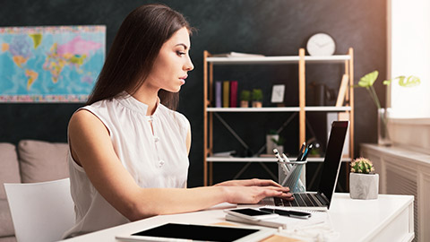 woman sitting at computer in office