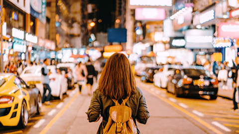 girl standing of street in an unspecified asian country