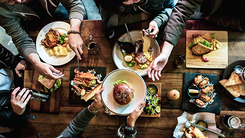 group of people around a restaurant table