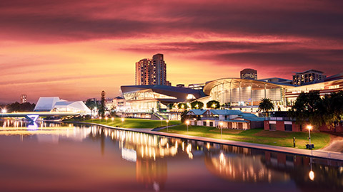 adelaide skyline with a fiery sunset behind