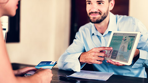 client being shown information on a tablet device