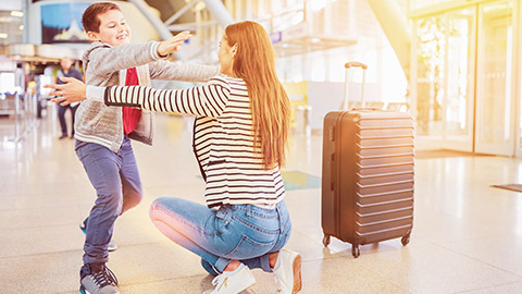 child and mother reunion at airport