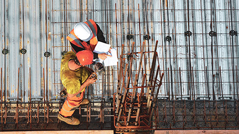 Top down view of 2 men on building site