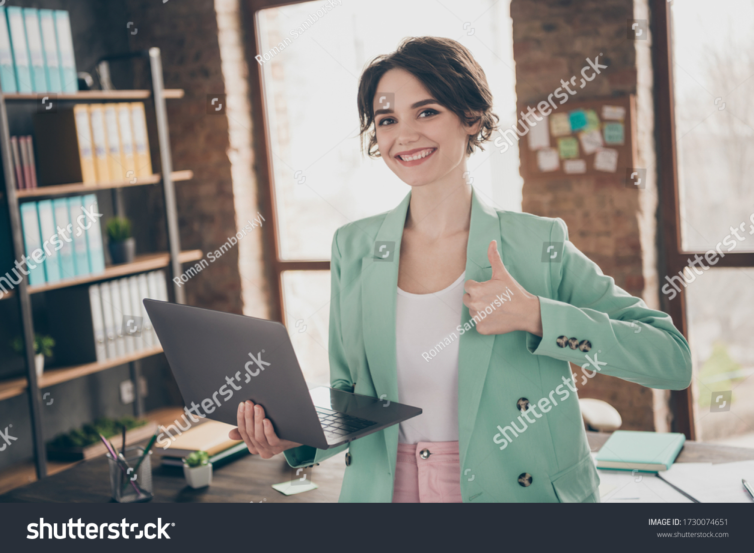  1730074651 Photo of business lady holding notebook raise thumb up smiling to camera