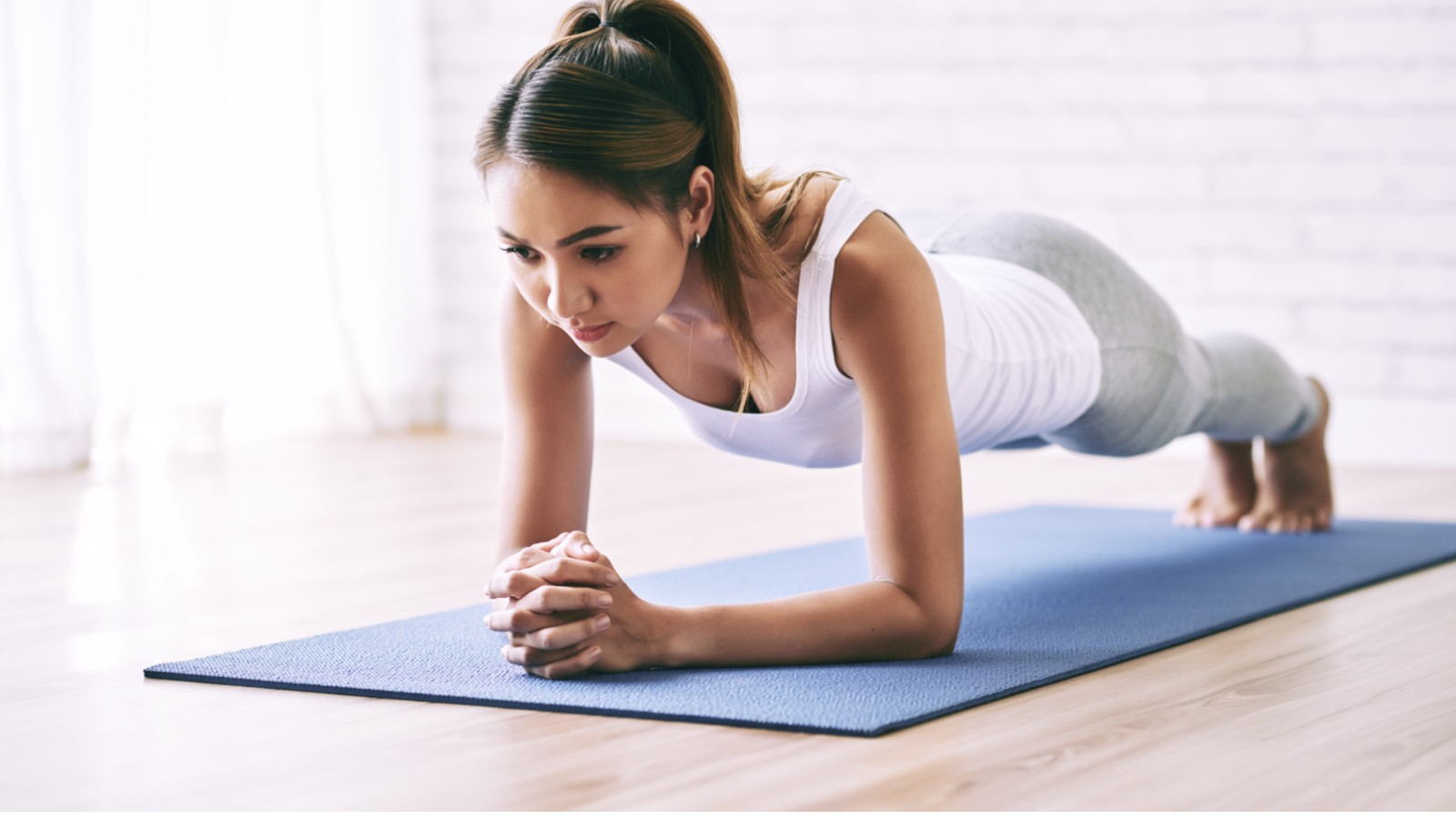 Woman doing plank exercise during a fitness session