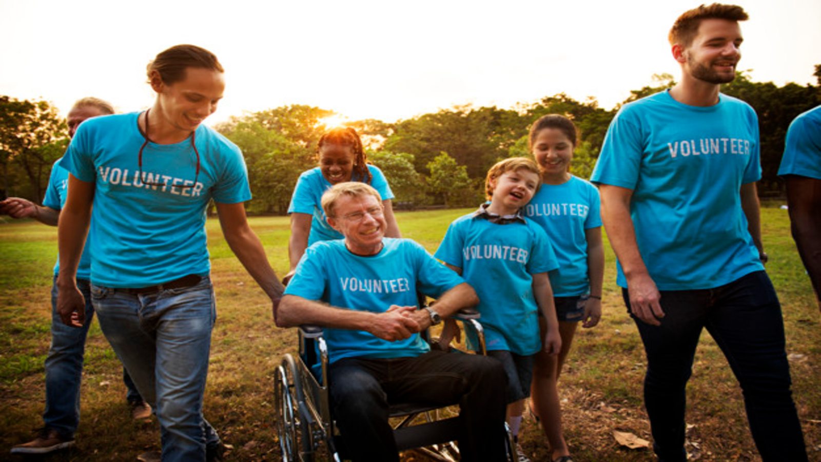 A group of volunteers including a person in a wheelchair.