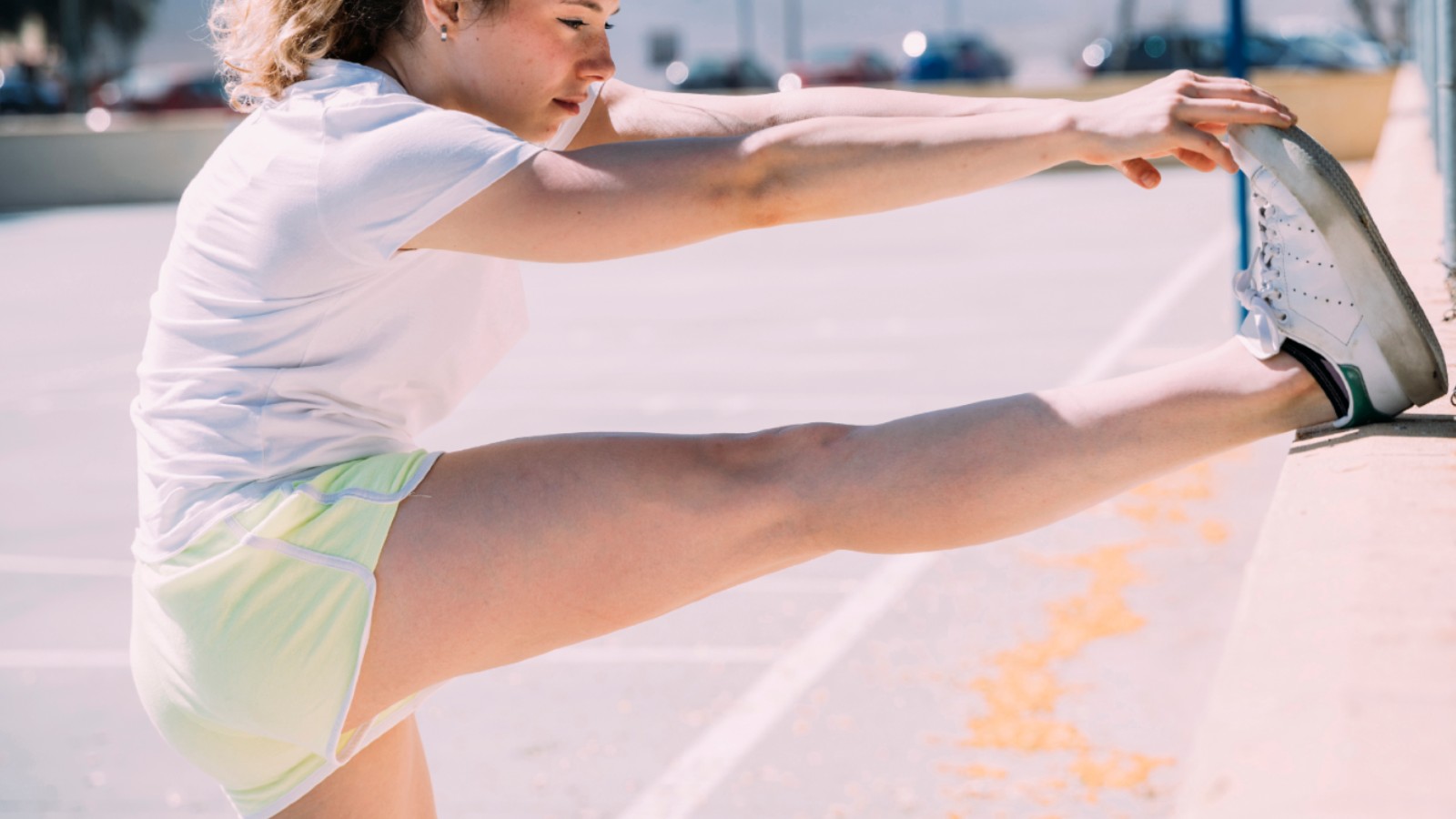 Teenage girl stretching her leg