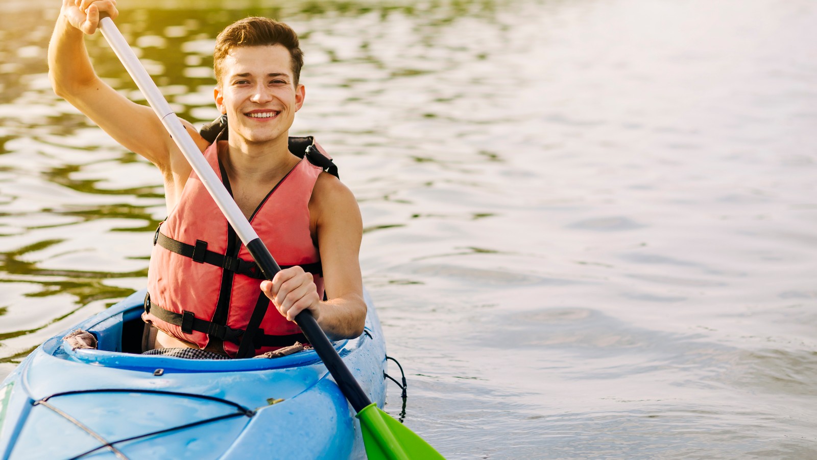 Man kayaking on a lake