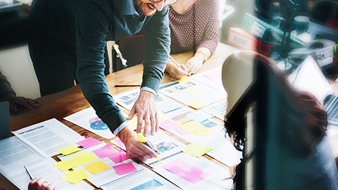 Group of marketing professionals discussing strategy