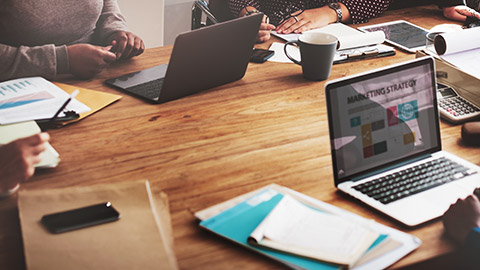 Group of people at table working on marketing strategy