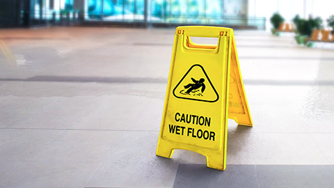 Caution sign on floor of modern office