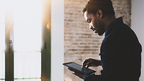 A person using their tablet