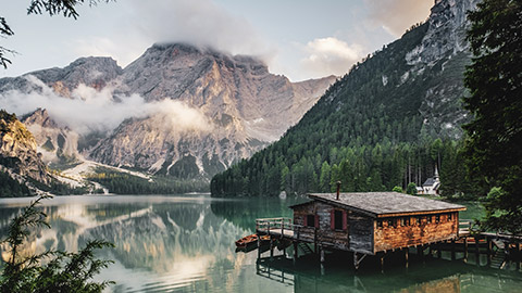 Wide shot of cabin on a lake